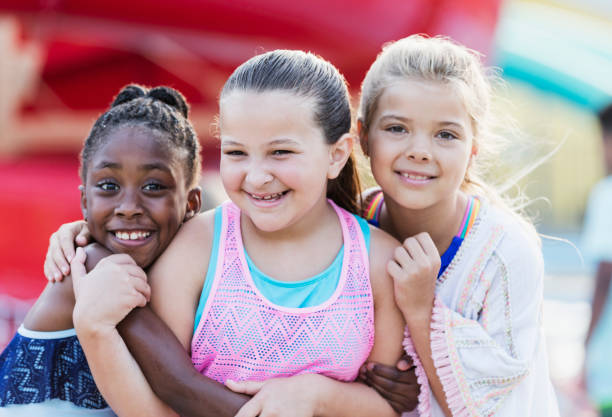 istock Best friends having fun at water park 1305387695