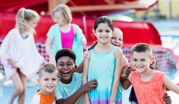 istock Group of friends having fun at water park 1305387712