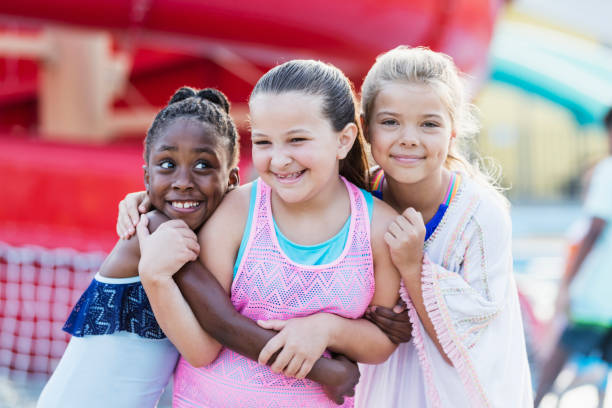 istock Best friends having fun at water park 1305387736