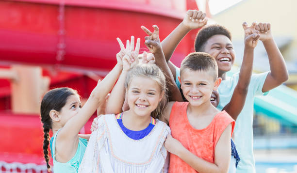 istock Group of friends having fun at water park 1305387749