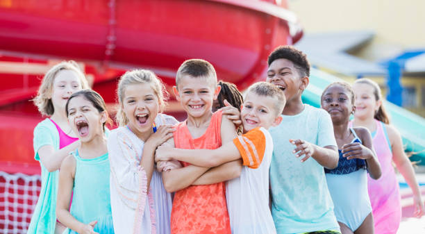 istock Group of friends having fun at water park 1305387808