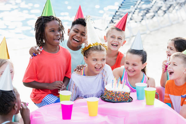 istock Children at birthday party, ready for cake 1305388400