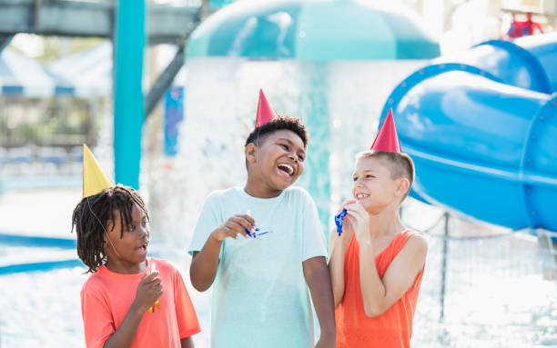 istock Three boys, birthday party at water park 1305388448