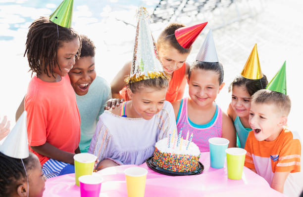istock Children at birthday party, ready for cake 1305388469