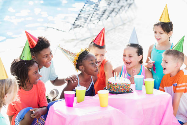 istock Children at birthday party, ready for cake 1305388484