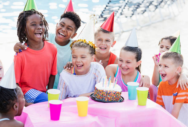 istock Children at birthday party, ready for cake 1305388507