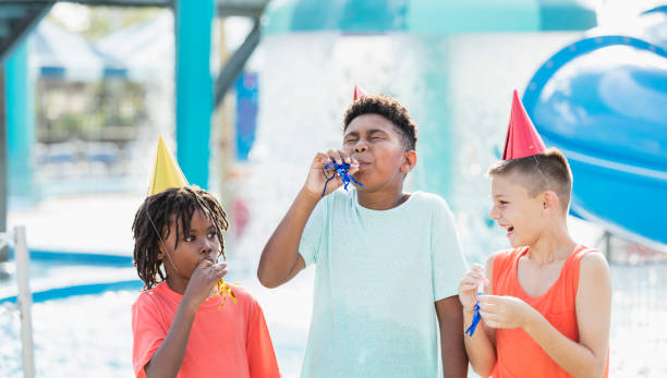 istock Three boys, birthday party at water park 1305388552