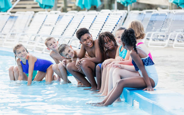 istock Group of friends having fun at water park 1305388557