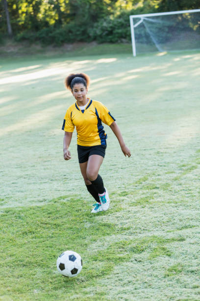istock Girl playing soccer 1305388585