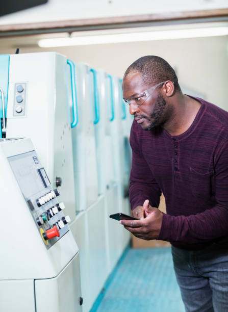 istock African-American man working in printing plant 1305389106