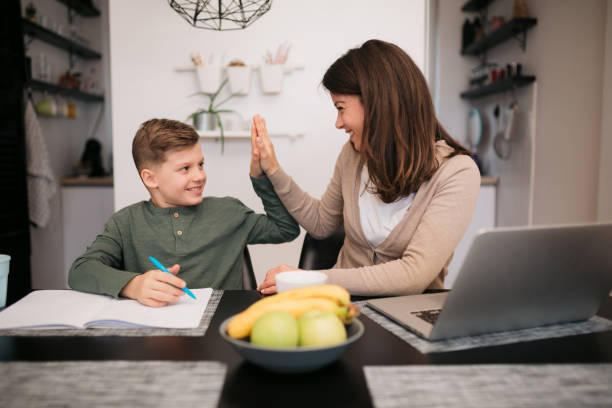 istock Happy Caucasian mother working from home 1305391825