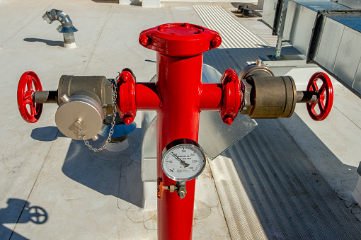 Fire hydrant on roof of residential building.