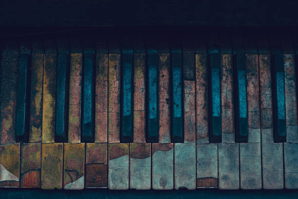 Old Piano Keys Overhead view of Old Piano Keys in very bad condition abstract musical instrument stock pictures, royalty-free photos & images
