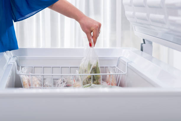 istock A woman putting some vegetables in the fridge 1305395099