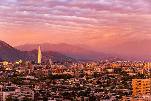 View of Santiago de Chile City at orange pink sunset