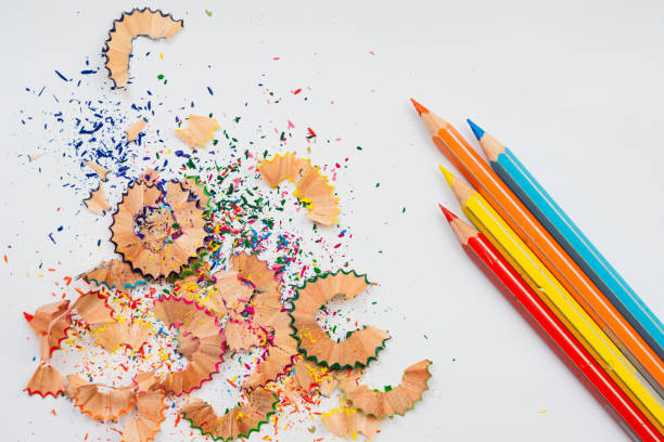 istock Coloured pencil shavings and pencils on the white background 1305397123