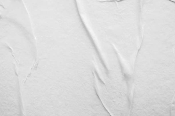 istock Blank white crumpled and creased paper poster texture background 1305403305