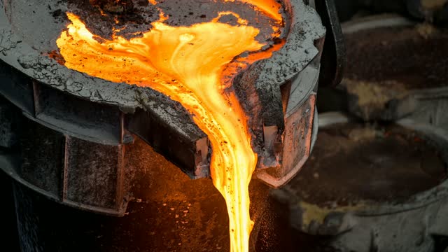Tank pours liquid metal at the steel mill. Cinemagraph.