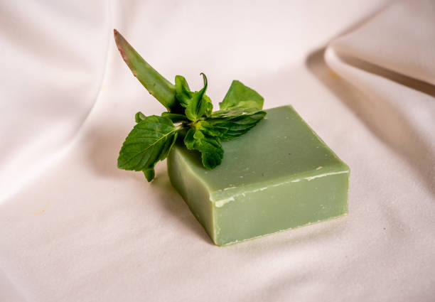 istock Refreshing green color soap made of mint with white background. 1305406161