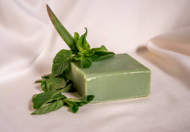 istock Refreshing green color soap made of mint with white background. 1305406167