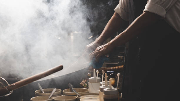 istock Chef stir fry busy cooking 1305416777
