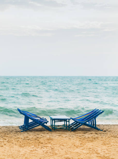 istock Beach chair in front the sea 1305416783