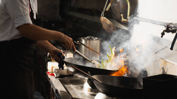 istock Chef stir fry busy cooking 1305416793
