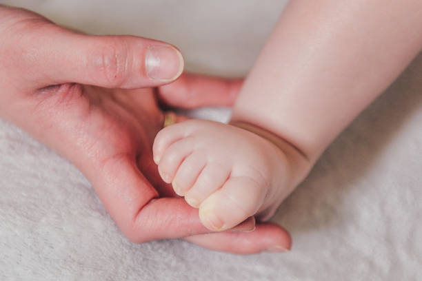 istock Foot of small baby 1305418405