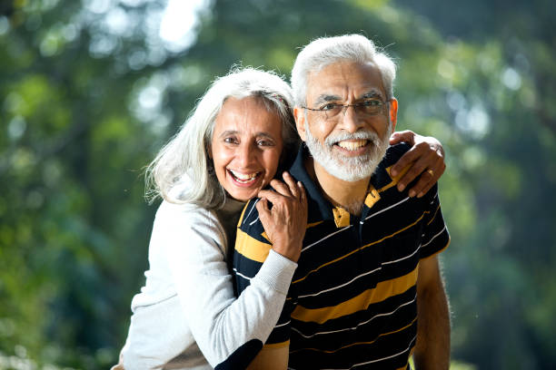 istock Loving senior couple at park 1305419246