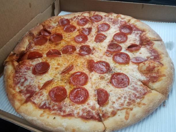istock hot pepperoni pizza with cheese in box or container 1305419378