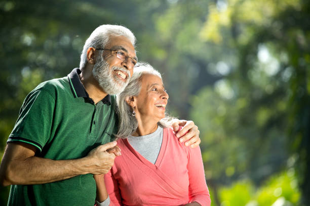 istock Happy senior couple admiring view at park 1305420069