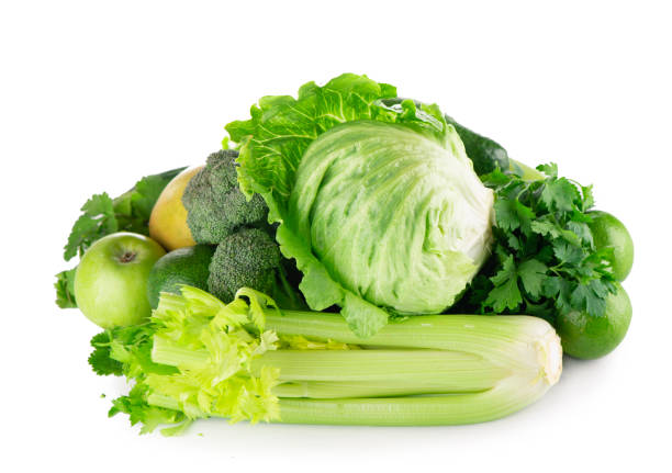 istock green fruits and vegetables on white background 1305420327