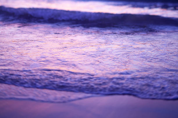 istock Abstract color photo of small ocean wave during sunset 1305420501