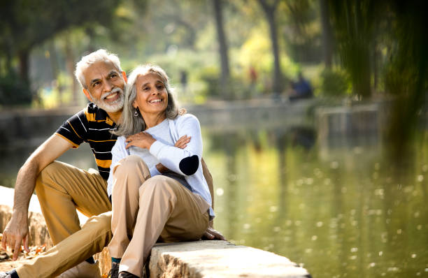 istock Senior couple spending leisure time and admiring view at park 1305421200