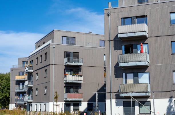 istock Modern apartment houses with grey facades 1305428731