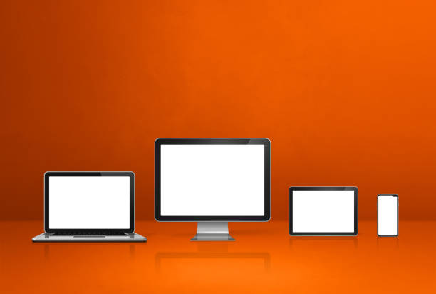 istock computer, laptop, mobile phone and digital tablet pc. orange background 1305432213