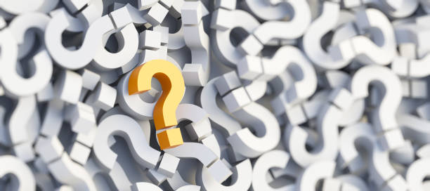 istock Yellow question mark on a background of white signs, FAQ Concept 1305432402