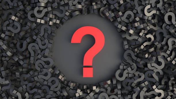 istock Big red question mark on a background of black signs, top view, FAQ Concept 1305432404