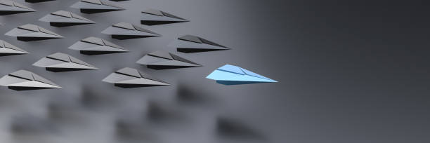 istock Leadership concept, blue leader plane leading black planes, on black background with empty copy space on right side 1305432450