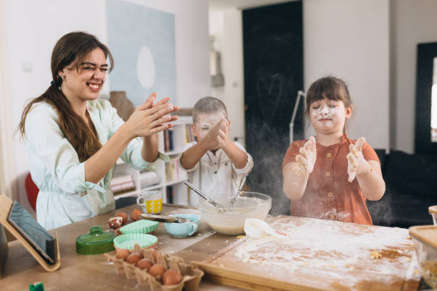 istock mother and children baking together at home 1305433761