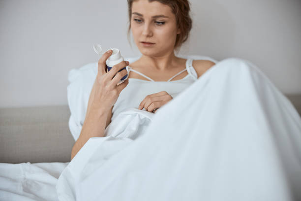 istock Close up of serious female looking at package 1305434607