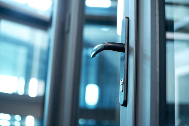 istock door handle with lock on the glass front door 1305437756