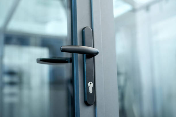 istock stylish door handle with lock on the glass door 1305437766