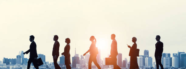 istock Walking people in front of city. 1305439300