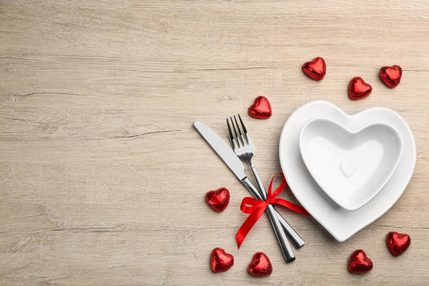 istock Beautiful table setting on white wooden background, flat lay with space for text. Valentine's Day dinner 1305440778