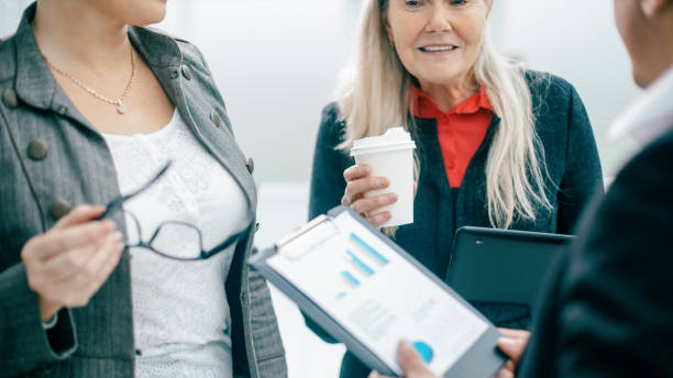 istock close up. employees discuss financial data during a coffee break 1305440807