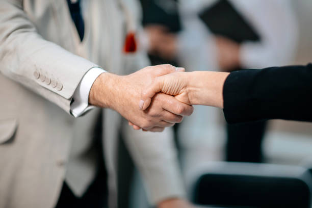 istock close up. business handshake on an office background 1305441755