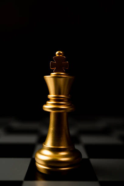 istock Golden Chess King standing alone on the chessboard 1305443581