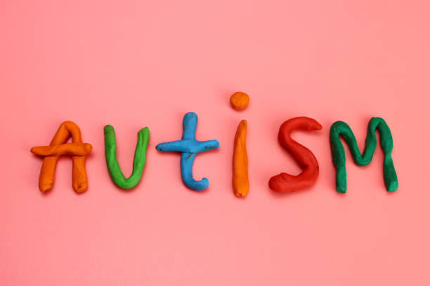istock autism word from made of colored modeling clay or plasticine on a pink background 1305443855
