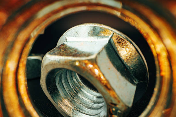 istock Metal nut on black background close up 1305447417